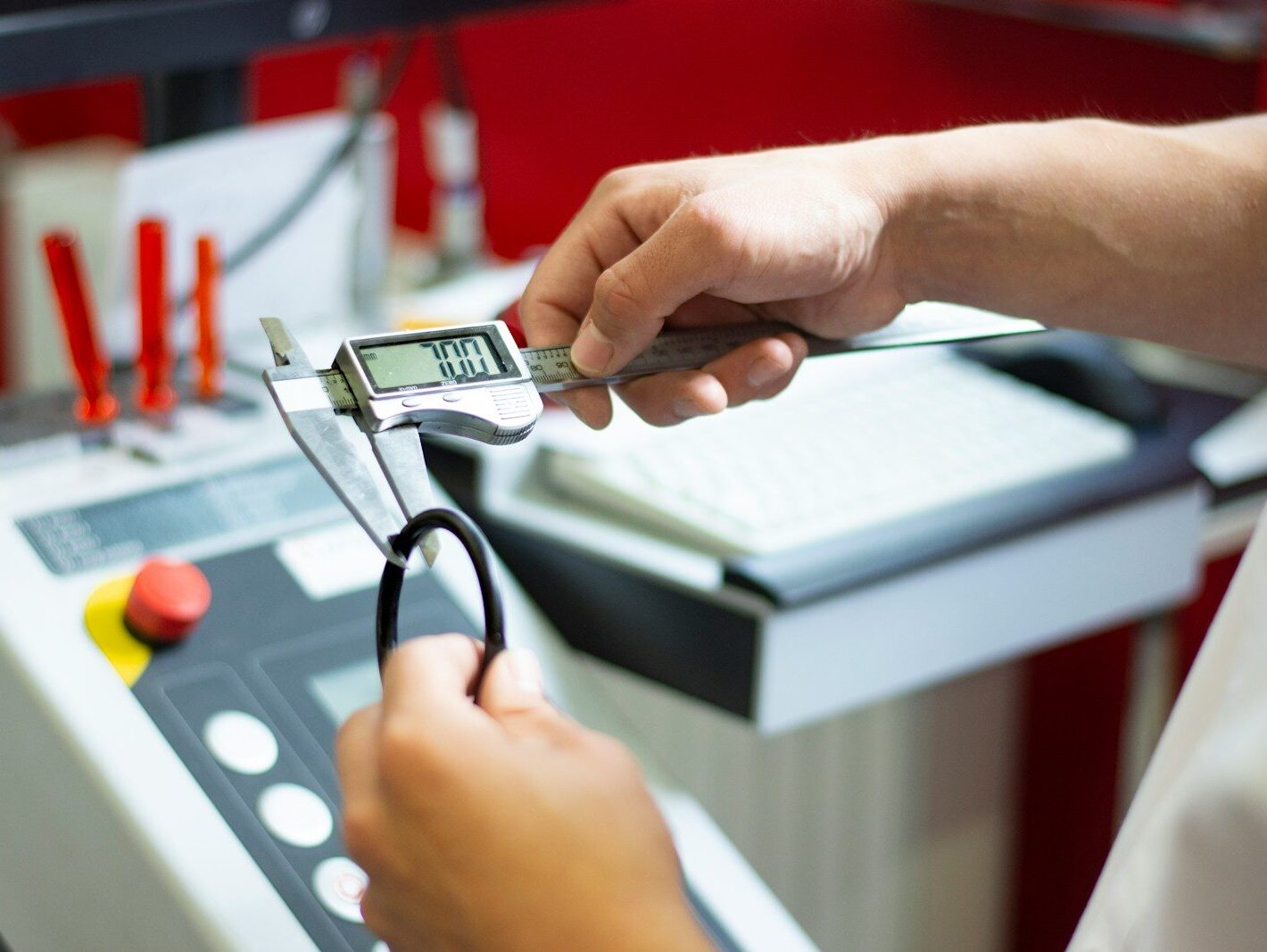 a person using a calculator on a machine